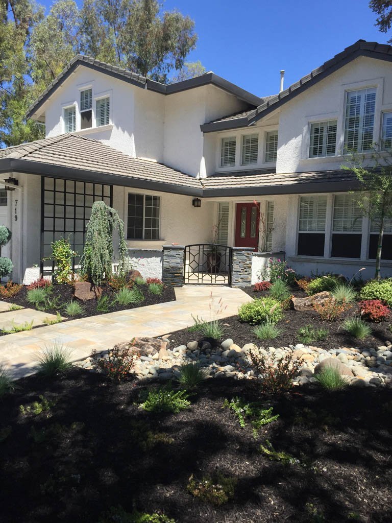 Two-story suburban home with landscaped front yard.