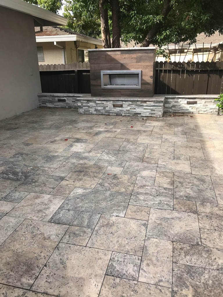 South Canyon Construction outdoor patio with a cozy fireplace