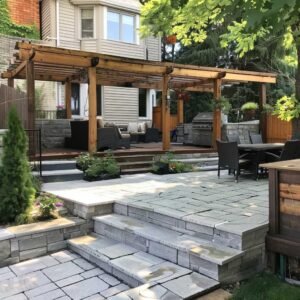 Elegant backyard patio with wooden pergola and stone tiles