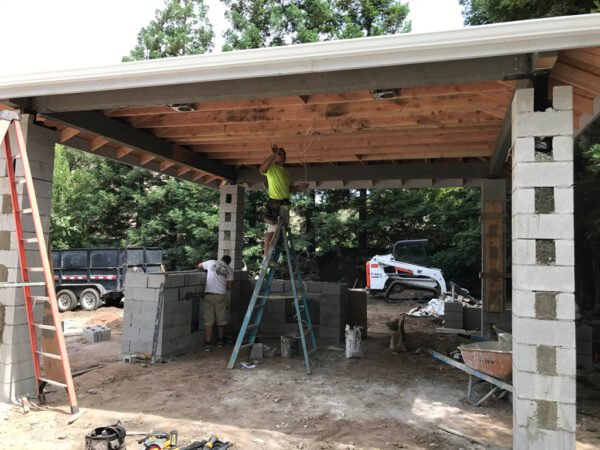 Workers designing a pergola in California