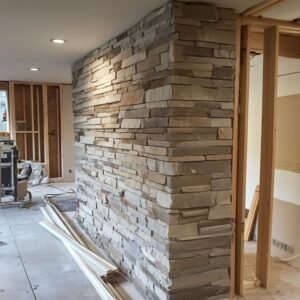 Interior construction site with stone wall installation