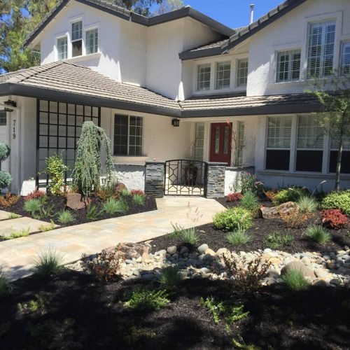 Two-story suburban home with landscaped front yard.