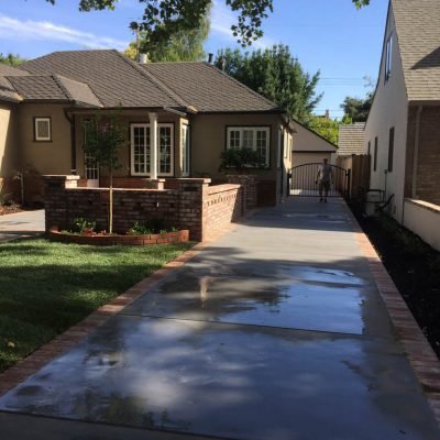 Suburban home pathway with person walking.